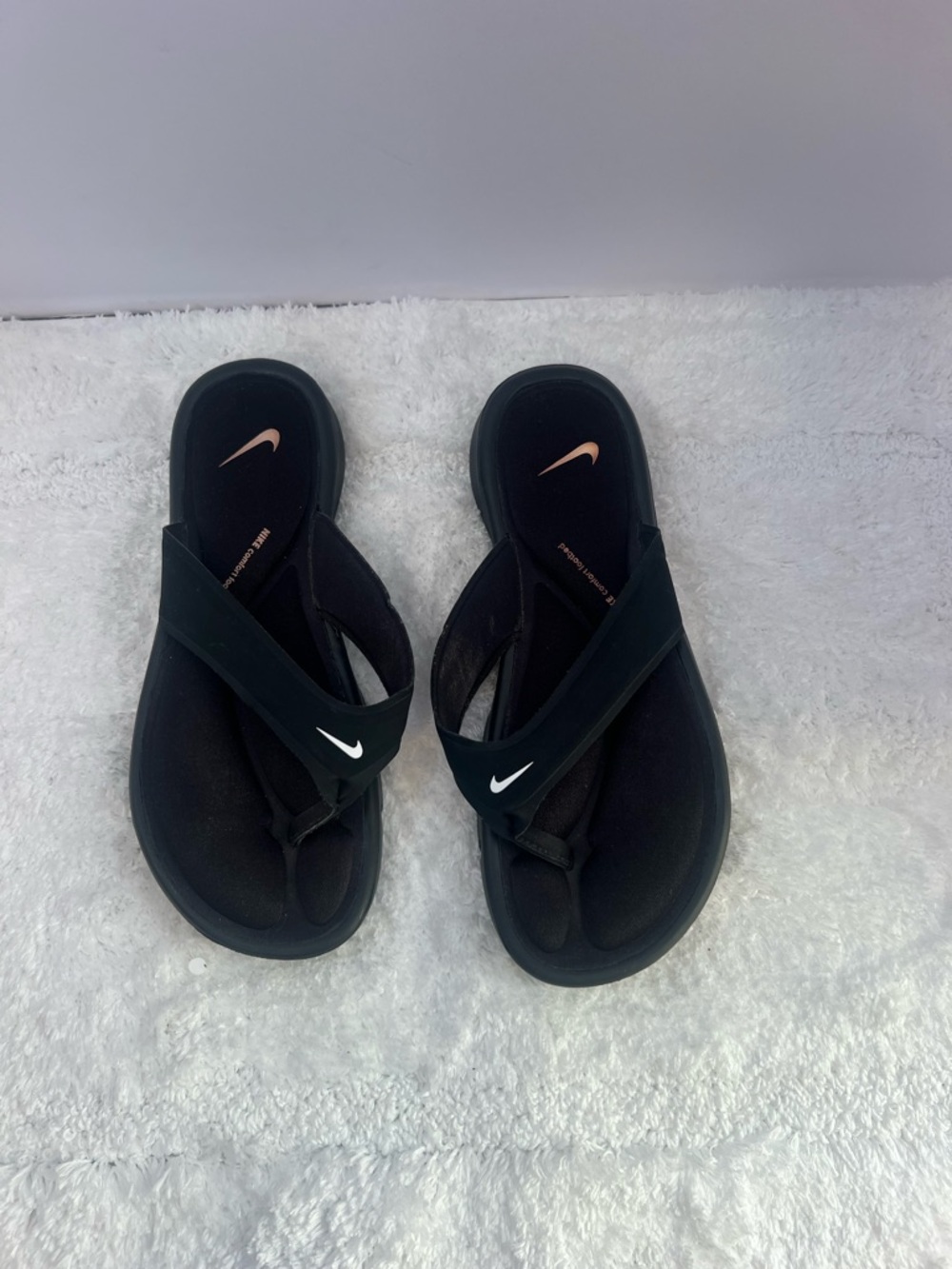 Nike Women’s Black Slip-On Thong Sandals with White Swoosh